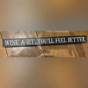 Black Wooden Sign with Wine Inspired Text